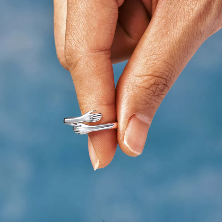 Anillo de abrazo de mano