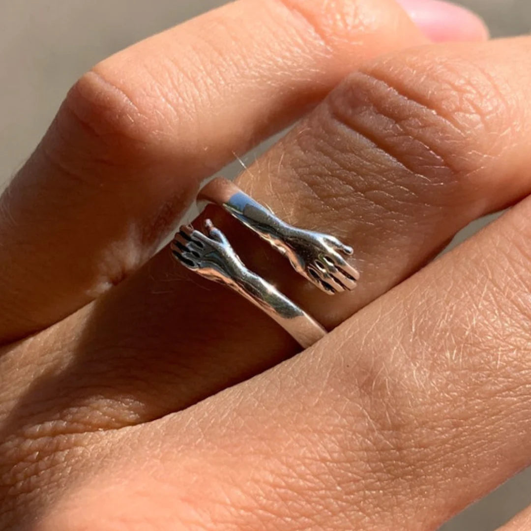 Anillo de abrazo de mano